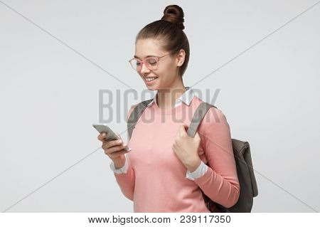 Horizontal Portrait Of Young Good-looking European Female Isolated On Grey Background Turned Leftwar