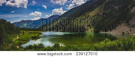 Beautiful Maroon Lake And Trail With Blue Sky And Clouds In Summer Near Aspen, Colorado