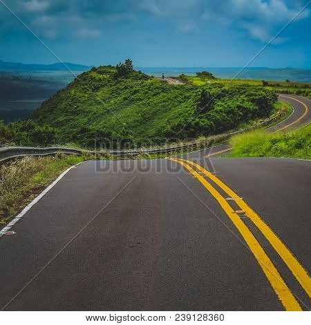 Curved Road Winding Through The Mountainous Terrain Of Waimea Canyon State Park, Kauai, Hawaii, Unit