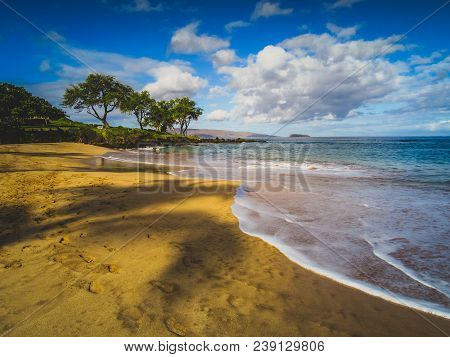 Calm Waves At Maluaka Beach On A Sunny Day With Shadows Of Palm Trees Cast Onto The Sand, Maui, Hawa