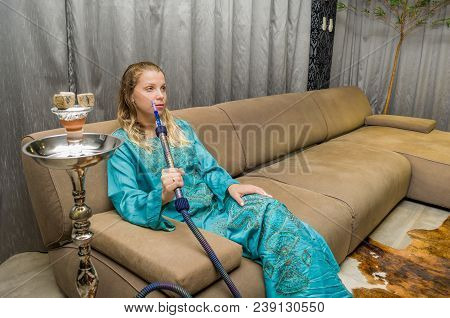 Woman Smoking Traditional Hookah (narguile, Shisha, Chicha, Arguile), Equipment Used For Smoking Tob