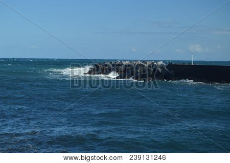 Wonderful Views Of The San Sebastian Bay From Its Promenade And Strong Waves Loading Against Your Br