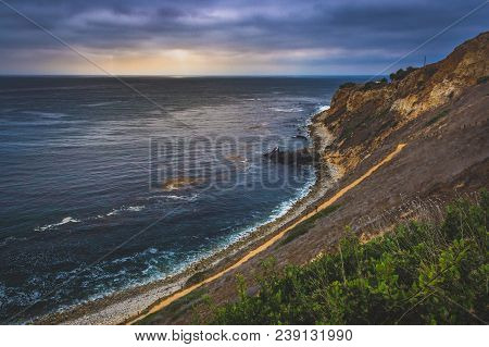 Coastal Hiking Trail Cascading Down The Steep Cliffs Of Pelican Cove Park On A Cloudy Day With Beams