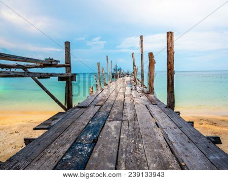Beatiful Beach With Wooden Dock In Paradise