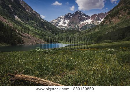 Majestic Maroon Bells Peaks And Maroon Lake On A Sunny Day And Blue Sky In Summer Near Aspen, Colora