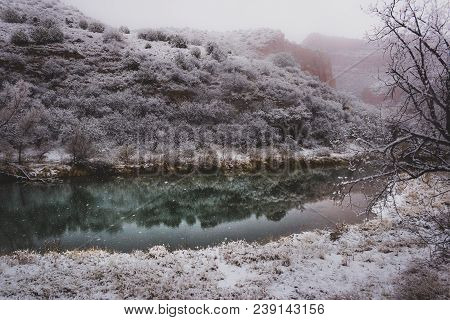 Calm Verde River With Reflections Of Snow-covered Red Rock Formations In Verde Canyon On A Snowy Day