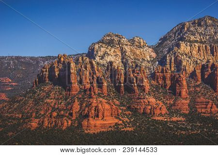 Elevated View Of Colorful Munds Mountain Covered With Patches Of Snow Near The Peak, Sedona, Arizona
