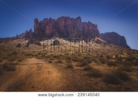 Iconic View Of Superstition Mountains And Saguaro Cacti In Lost Dutchman State Park, Arizona From Tr