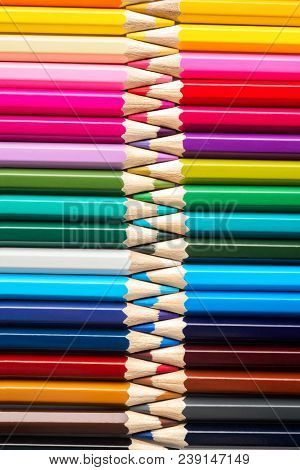 Set Of Colored Pastel Pencils In Row Multi Color In Form Of Closed Zipper And Pencil Sharpener Conce
