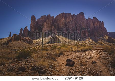 Iconic View Of Superstition Mountains And Saguaro Cacti In Lost Dutchman State Park, Arizona From Tr