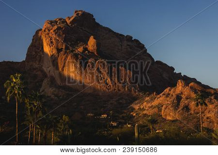 Popular Camelback Mountain With Patches Of Sunlight Cast Upon The Peak At Sunrise, Paradise Valley,