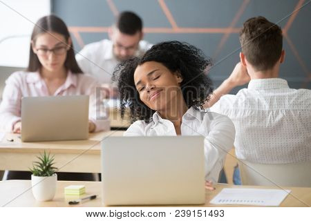 Relaxed Smiling African Woman Enjoying Break In Coworking, Happy Millennial Black Office Worker Or S