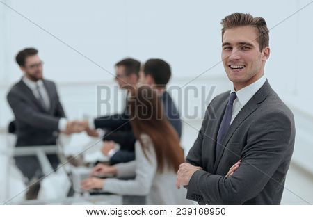 Business partners shaking hands over business objects on workpla