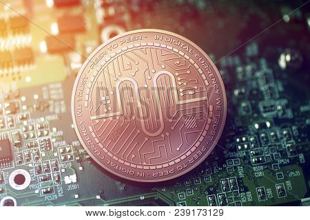 Shiny Copper Authorship Cryptocurrency Coin On Blurry Motherboard Background Token
