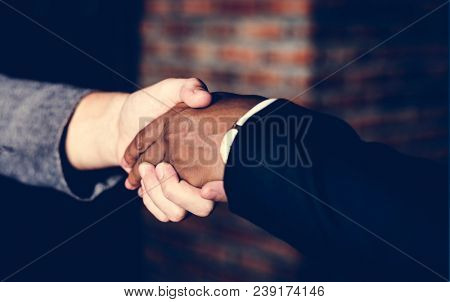 Businessmen shaking hands in a agreeement