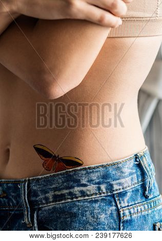 Closeup of lower hip tattoo of a woman