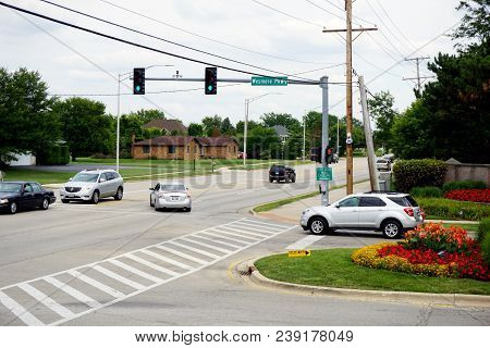 Joliet, Illinois / United States - August 13, 2017: Vehicles Pass Through The Intersection Between W