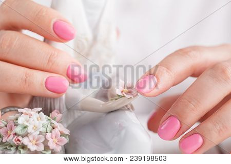 Female Hands With Porcelain Figurine Close Up