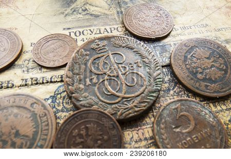 Pile Of Vintage Metall (copper) Coins.coins Of The Russian Empire In The Background Kopyur.antikvari