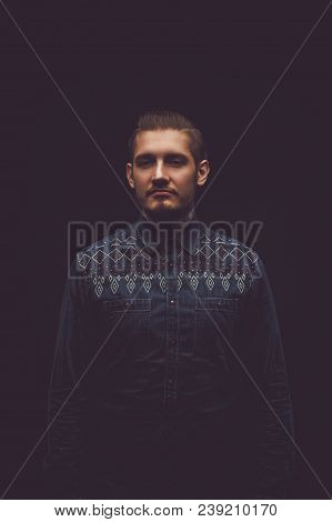 Portrait Of Smiling Male In Colorful Sweater And Tattooed Arms.