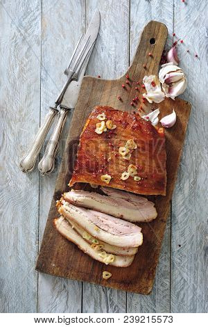 Oven Roasted Pork Bacon With Garlic And Red Peppercorns.