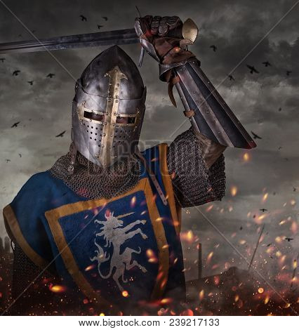 Portrait Of A Knight With Sword On Batllefield. Knight With Sword In Battlefield.