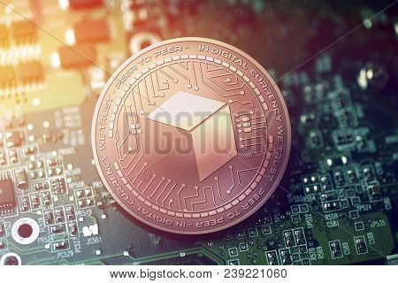 Shiny Copper Brickblock Cryptocurrency Coin On Blurry Motherboard Background Token