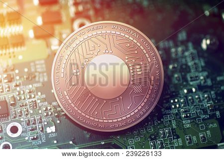 Shiny Copper Byteball Cryptocurrency Coin On Blurry Motherboard Background Token