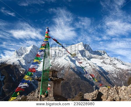 Panoramic View Of Kangtega And Thamserku Peaks And Ancient Stone Chorten Above Namche Bazaar In Saga