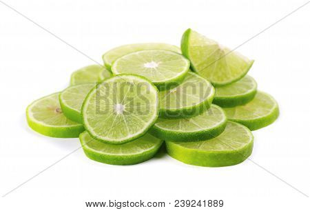 Ripe Slice Of Green Lime Citrus Fruit Isolated On White Background. Lime Wedge With Clipping Path.