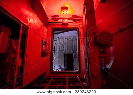 Gateway Corridor Of Airlock Of Abandoned Bunker. Big Hermetic Door.