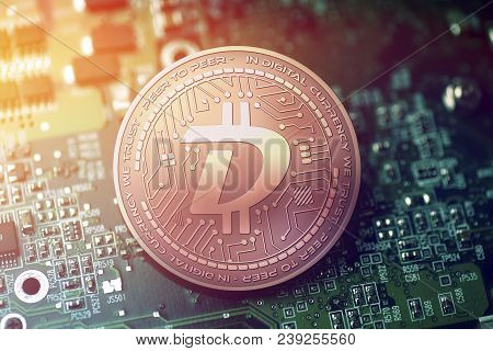 Shiny Copper Digibyte Cryptocurrency Coin On Blurry Motherboard Background Token