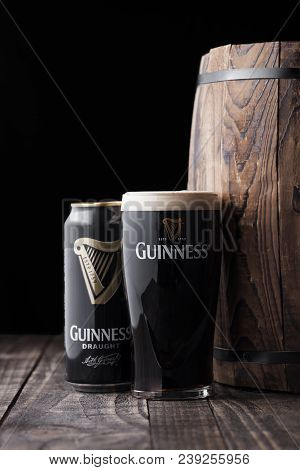 London, Uk - May 03, 2018: Aluminium Can And Original Glass Of Guinness Draught Stout Beer Next To W