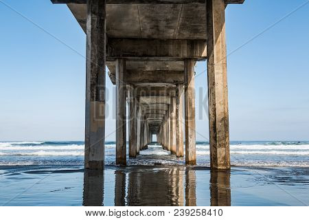 Beneath The Symmetrical Concrete Pier At La Jolla Shores In San Diego, California.