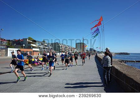 Helsingborg, Sweden - 05 May, 2018: People running competition along the coast of Oresund strait. IFK Helsingborg City Run Springtime performs the 38th edition