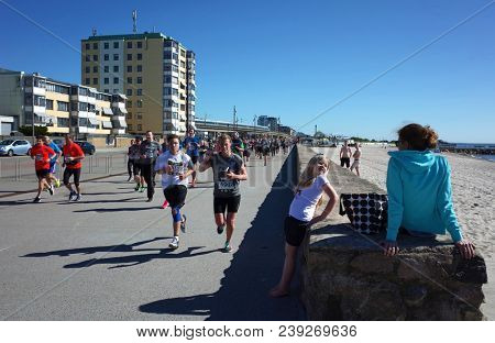 Helsingborg, Sweden - 05 May, 2018: People running competition along the shore of Oresund strait. IFK Helsingborg City Run Springtime performs the 38th edition