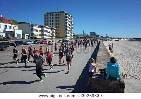 Helsingborg, Sweden - 05 May, 2018: People running competition along the coast of Oresund strait. IFK Helsingborg City Run Springtime performs the 38th edition