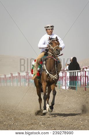 Ibri, Oman, 28th April 2018: Omani Men At A Traditional Horse Race Event Where Young Riders Show The