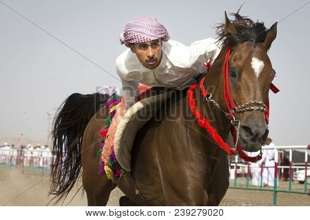 Ibri, Oman, 28th April 2018: Omani Men At A Traditional Horse Race Event Where Young Riders Show The