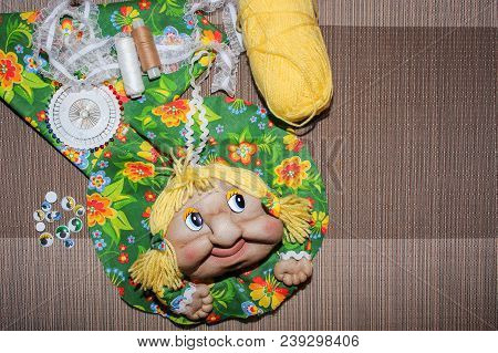 Creativity Needlework Rag Doll On Grey Background With Copyspace. Russian Folk Crafts
