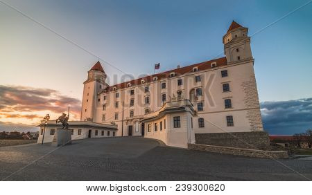 Bratislava Castle Or Bratislavsky Hrad At Sunset. The Main Castle Of Capital City Of Slovakia.