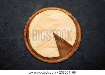 Whole Round Head And Pieces Of Parmesan Or Parmigiano Hard Cheese