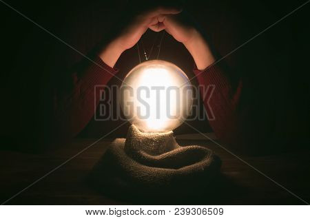 Crystal Ball And Fortune Teller Hands. Divination Concept. The Spiritual Seance. Future Reading.