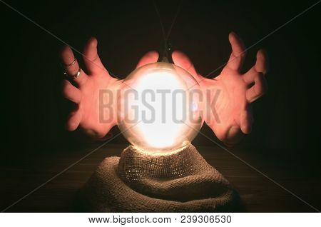 Crystal Ball And Fortune Teller Hands. Divination Concept. The Spiritual Seance. Future Reading.