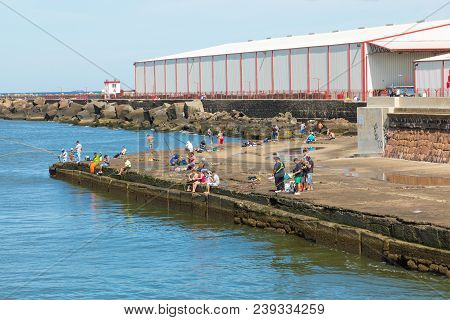 Montevideo, Uruguay - February 03, 2018: People Fishing At Boulevard In Montevideo, Uruguay. Montevi