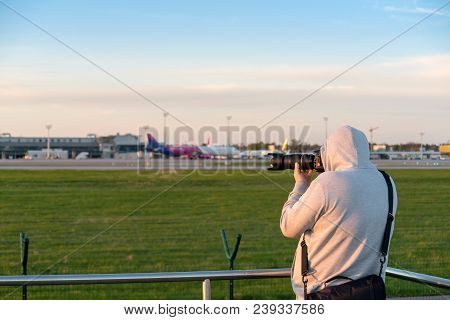 Gdansk, Poland - May 5, 2018: Plane Spotter Taking A Photo Of An Airplane Landing At Lech Walesa Air