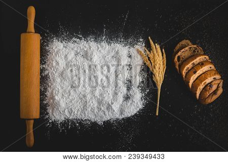 Top View Of Baking Concept , Rolliing With Baking Powder And Bread With
