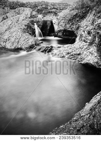 Multiple Waterfalls On River Brittle  With Many Cold Swimmable Pools. Black And White Photography