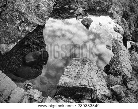 Multiple Waterfalls On River Brittle  With Many Cold Swimmable Pools. Black And White Photography