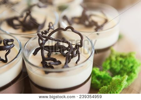 Panna Cotta In Glasses, Closeup. Italian Dessert As Part Of Party Dessert Stand. Candy Bar And Cater